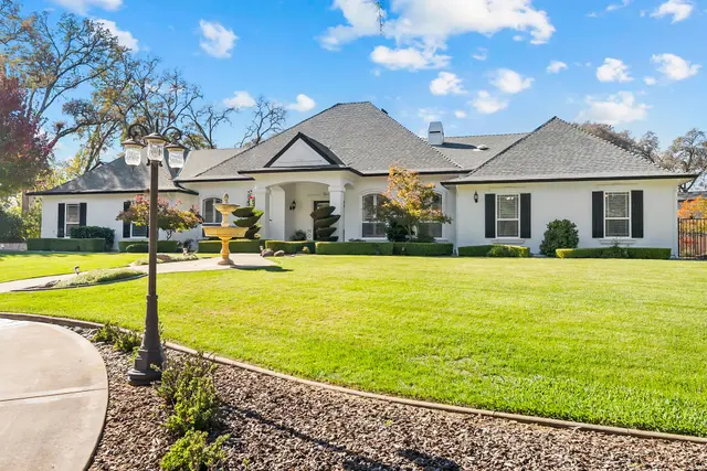 Front lawn and lamp post leading to the home
