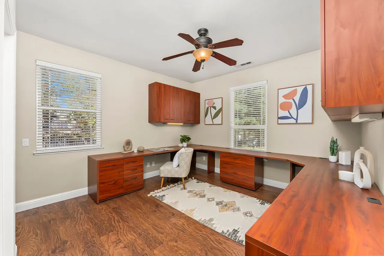 Bedroom with custom built-in desks, ideal as a home office